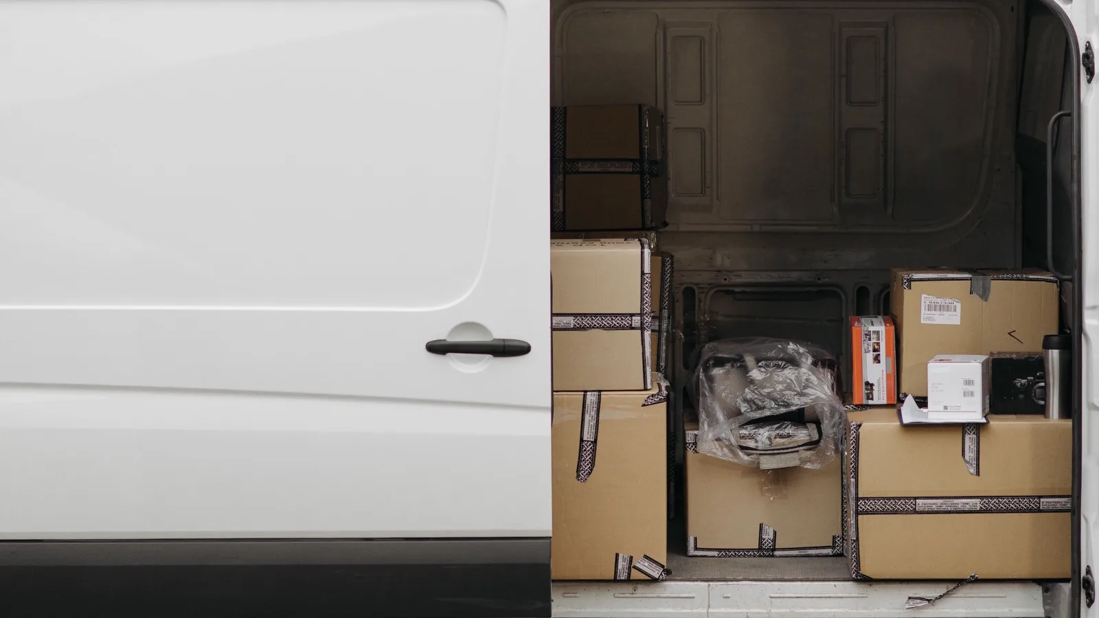 Photo by Pavel Danilyuk on Pexels Boxes inside an open white cargo van.
